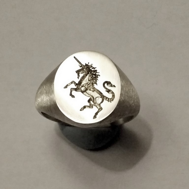 Unicor deeply engraved silver signet ring